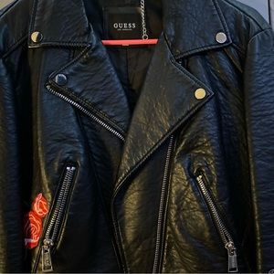 This is a large Guess black vintage leather jacket